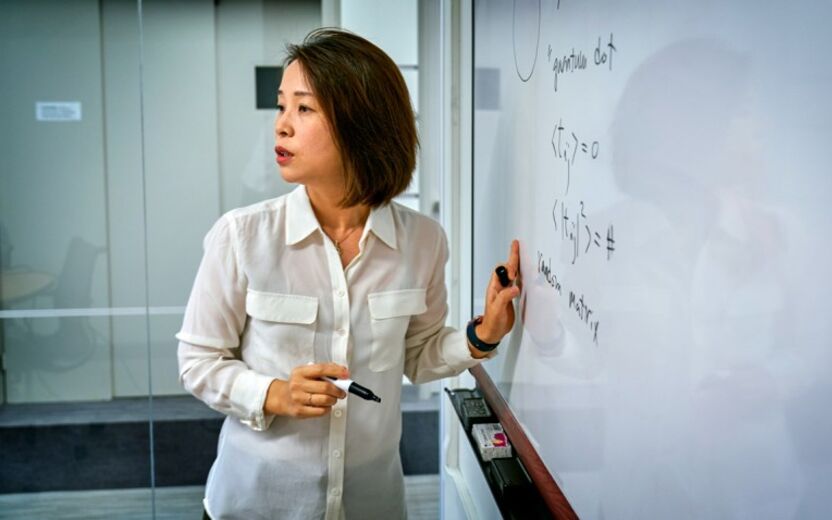 Physicist Eun-Ah Kim at whiteboard